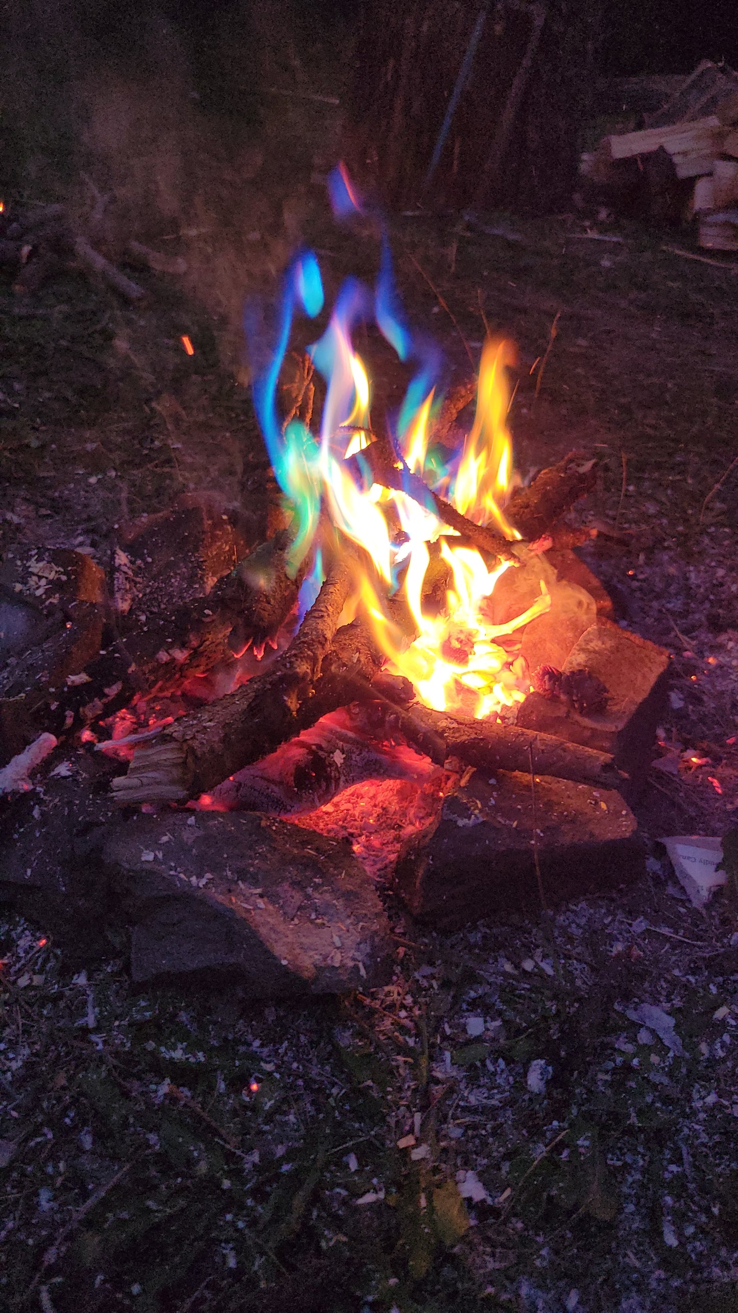 Campfire using Aurora Inferno campfire color changing pack displaying vibrant blue and green flames.